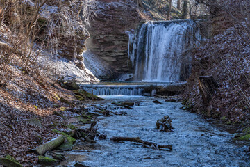 waterfall in the spa park of Heilbad Heiligenstadt, Germany on a cold winter day