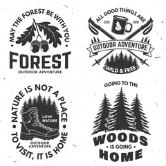Fototapeta premium Set of logo, badge design with inspirational adventure quotes. Concept for shirt or logo, print, stamp or tee with oak leaf and acorns, hiking boot, pin forest, coffee or tea mug, hiking poles. Vector