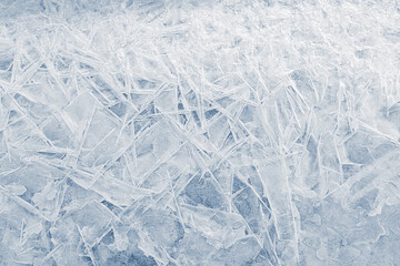 Obraz premium Ice texture crystal, blue tones, background. Frozen texture. Textured cold frosty surface of ice.