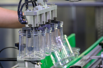 The high technology material handling process from injection machine by robotic system.