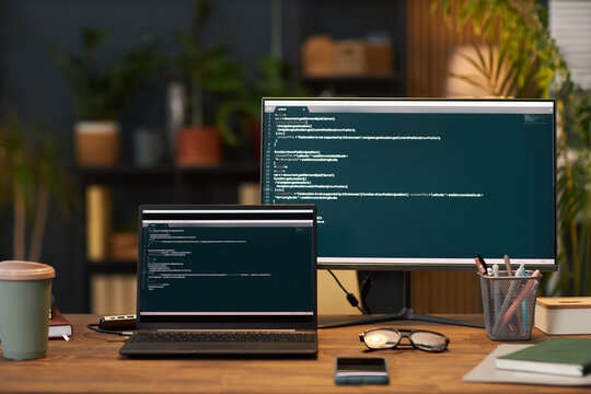 Security codes on computer monitors on workplace in eco office