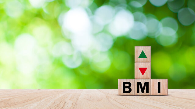 BMI big mac index symbol, Concept words BMI big mac index on wooden cube, Medicine and Body Mass Index concept, Doctor health.
