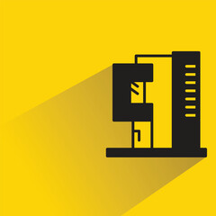 modern building icon with shadow on yellow background
