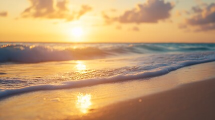 Obraz premium Serene beach at sunset, warm golden hues reflecting on calm waves, peaceful ambiance perfect for relaxation or inspiration.