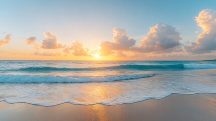 Obraz premium Serene beach at sunset, gentle waves lapping on shore, vibrant sky with clouds, perfect for relaxation or travel themes.