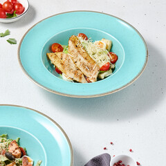 Vibrant Caesar Salad with Grilled Chicken in a Contemporary Light Setting