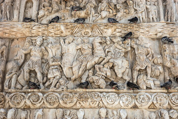 Arch of Galerius, detail. Pigeons sitting on an ancient Roman relief. Thessaloniki, Greece.