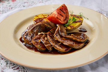 Gourmet Dish of Tongue in Demi-Glace Sauce with Fire-Grilled Potatoes and Baked Tomato