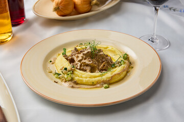 Velvety Mashed Potatoes with Veal Stroganoff – Warm Earthy Tones and Soft Lighting in a Culinary Composition