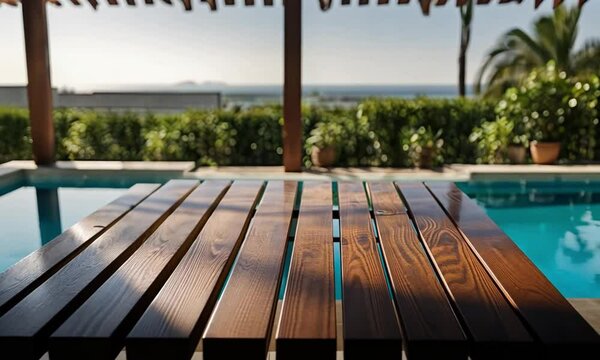 Sunlit Wooden Table with a Soft-Focus View of a Refreshing Pool
