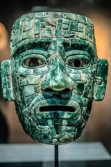 Ancient mayan ritual mask display museum exhibit cultural artifact indoor gallery close-up view historical significance