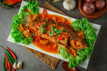 South asian cuisine. Malaysian dish.
 Crunchy sweet sour fish/Ikan masak tiga rasa. top view 