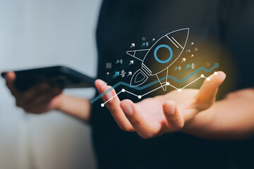 Business Growth and Innovation Concept with Rocket and Digital Graph in Hand, Business concept