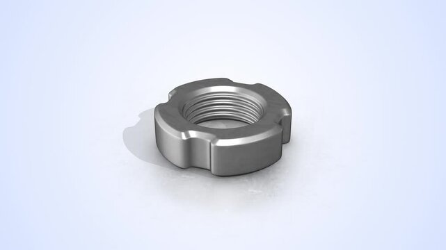 Slotted Nut on a Light Reflective Floor. Stainless Steel Slotted Nut. 4K