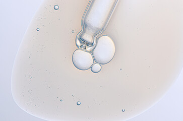 Textured background of cosmetic moisturizing gel or skin serum