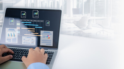 Project management tool and work schedule concept, Businessman use laptop to manager working projects and update task with gantt chart schedule to Business plan and progress, Planning software.