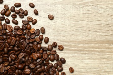 Coffee beans on wooden background