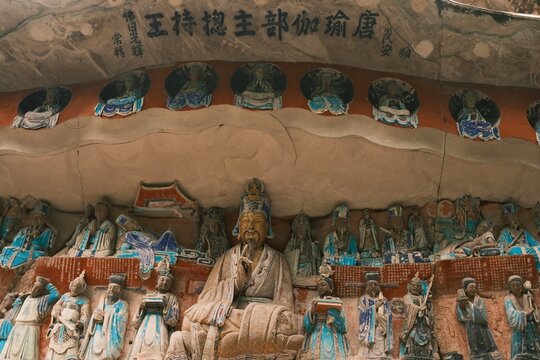 Dazu：A series of Chinese religious sculptures and carvings and UNESCO World Heritage Site located in Dazu District, Chongqing, China. The carvings date back as far as the 7th century AD