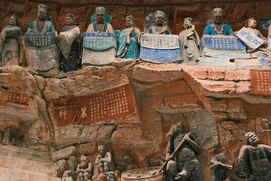 Dazu：A series of Chinese religious sculptures and carvings and UNESCO World Heritage Site located in Dazu District, Chongqing, China. The carvings date back as far as the 7th century AD