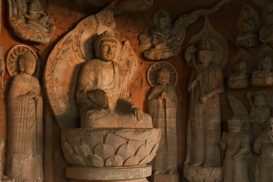 Dazu：A series of Chinese religious sculptures and carvings and UNESCO World Heritage Site located in Dazu District, Chongqing, China. The carvings date back as far as the 7th century AD