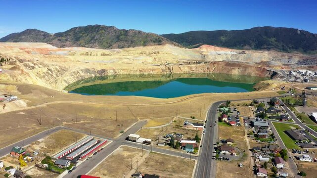 Aerial view of Berkeley Pit, in Butte, Montana with slow forward motion. The Berkeley Pit is a former open-pit copper mine in Butte, Montana that is now a toxic lake.