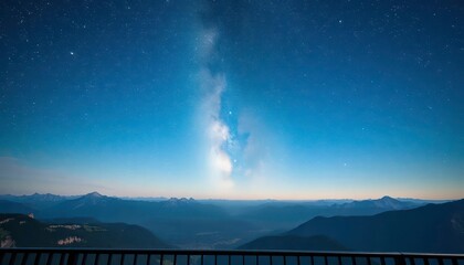 Starry sky over majestic mountains viewed from a balcony, night photography, mountain range