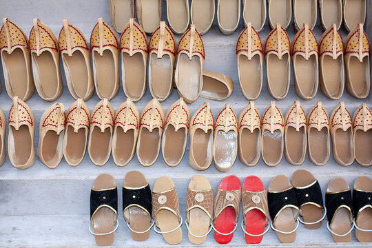 Close-up of rows of assorted traditional shoes for sale in a Shoe shop, Pushkar, Rajasthan, India