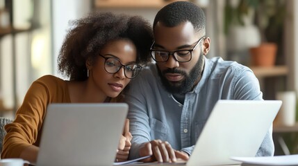 A couple reviews diverse mutual fund options their thoughtful faces showing responsibility and planning