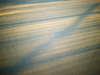 Dramatic light rays on street pavement background