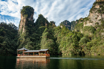 Boat tour in Baofeng lake in the Wulingyuan scenic area. Beautiful lush landscape in Zhangjiajie National Forest Park.