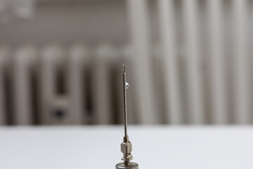Old glass syringe with needle