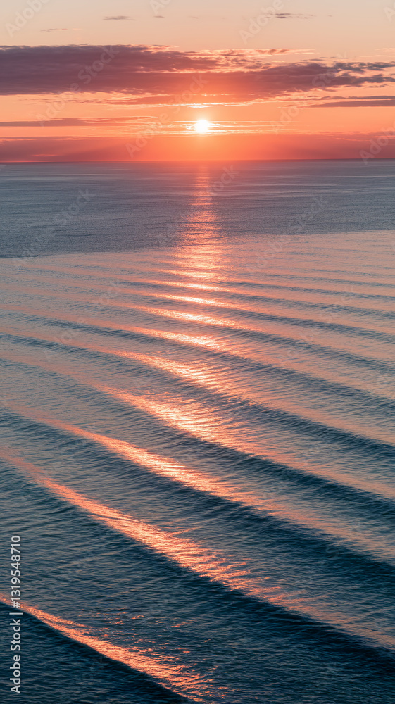 Poster Orange sunset reflecting on ocean waves, creating a textured pattern of light and shadow, showcasing serenity and calm, ideal for peaceful themes
