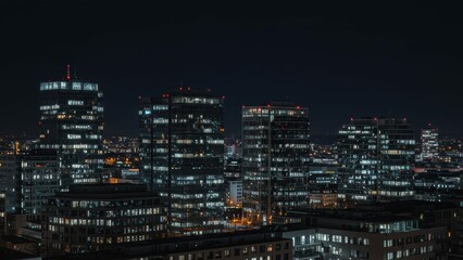 Nighttime cityscape featuring modern skyscrapers in Cape Town, illuminated buildings display urban life and contemporary aesthetics