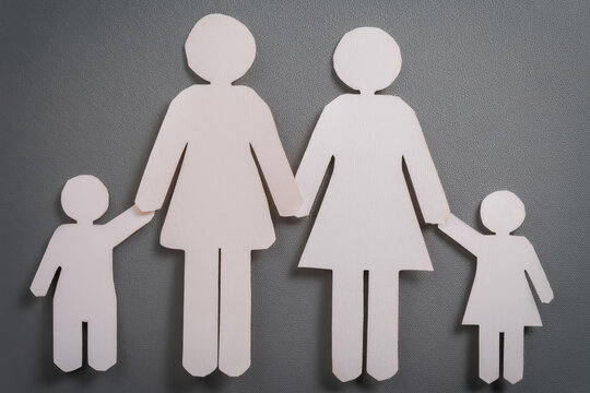 Family with two mothers and two child LGBT concept. Family of paper cutout figures