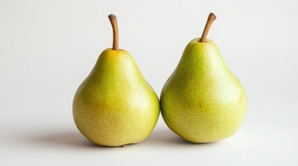 Two pears on a white background; still life; fresh fruit; food photography; stock image