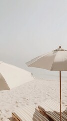Tranquil beach with white sand and umbrellas on a clear day