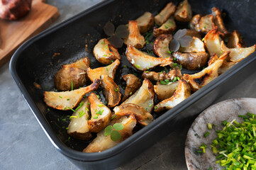 Close-up of fried Jerusalem artichoke wedges with a golden crust.