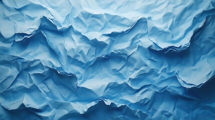 Obraz premium A textured canvas of crumpled blue paper, where deep folds and varying shades of azure create a sense of depth and texture, evoking the mood of a quiet day spent indoors.