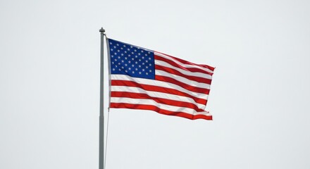 Fototapeta premium A Captivating View of the American Flag Waving Proudly Against the Sky