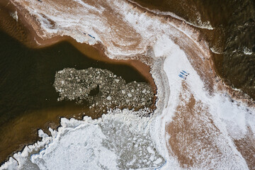 Aerial landscape of Baltic Sea beach in Mikoszewo at snowy winter. Poland