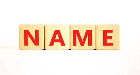 Fototapeta premium Name symbol. Concept word Name on beautiful wooden blocks. Beautiful white table white background. Business, lifestyle, support and name concept. Copy space.