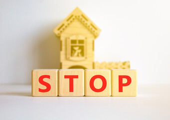 Stop symbol. Concept word Stop on beautiful wooden blocks. Beautiful white table white background....