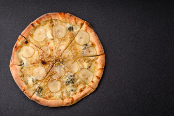 Delicious sweet pizza with pear, gorgonzola cheese and nuts