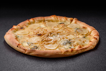 Delicious sweet pizza with pear, gorgonzola cheese and nuts