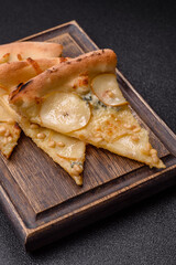 Delicious sweet pizza with pear, gorgonzola cheese and nuts