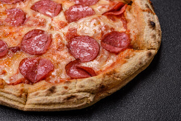 Pepperoni pizza with sausage, cheese, tomatoes, salt and spices