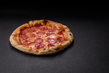 Pepperoni pizza with sausage, cheese, tomatoes, salt and spices