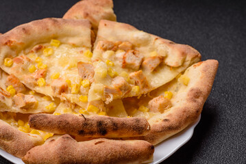 Hawaiian pizza with chicken, pineapple, corn and cheese