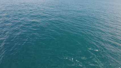 Turquoise Blue Indian ocean waves closeup from boat