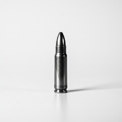 Single Bullet Isolated on White - A single bullet, symbolising danger, violence, conflict, power, and finality. Isolated on white background for impact